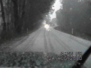 Hail over the road near the town of Hill Top.